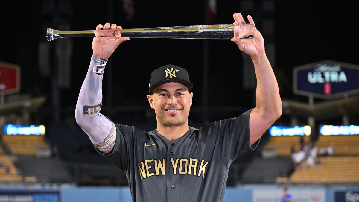 American League outfielder Giancarlo Stanton celebrates after being named Ted Williams most valuable player.