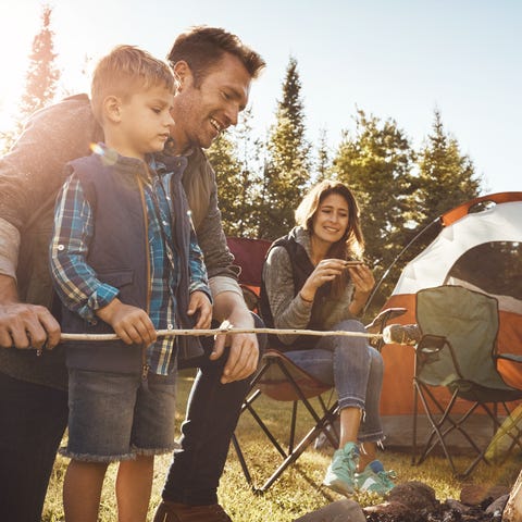 Shot of a young family camping in the forest