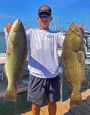 Walker Grigson, 14, of Mount Olive, Kentucky, caught both a 29- and 31-inch gag grouper while trolling in lower Tampa Bay with Capt. Capt. John Gunter recently.
