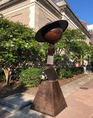 This recently erected public art sculpture in front of the Arts Council offices on Hay Street in downtown Fayetteville is topped with a likeness of the planet Saturn. The "real" Saturn reaches opposition in mid-August and will be observable all night.