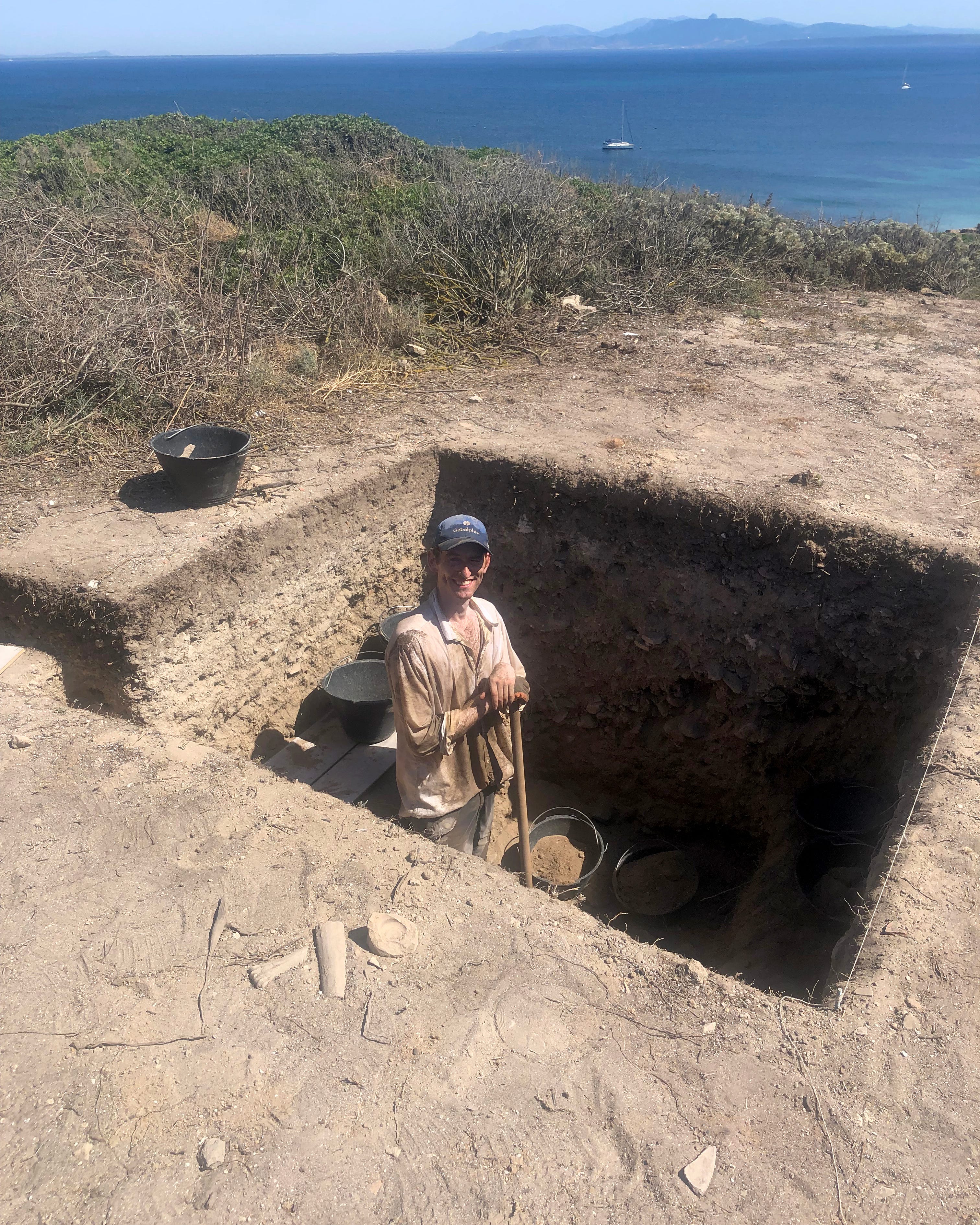 Patrick Hayes, working in Trench 6000, digs within view of the Mediterranean.