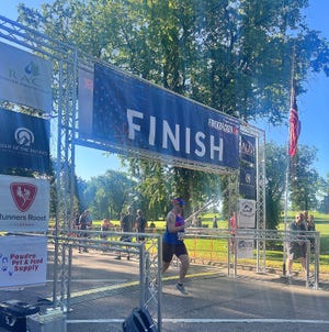 Stephanie Campbell finishes the 2022 FireKracker 5K race in Fort Collins City Park. Campbell was its first registered nonbinary category winner.