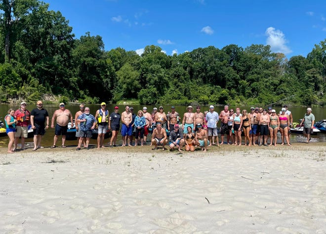 Jet ski riders from throughout the state pose for a group photo during last Saturday’s jet ski ride up the Pearl River, beginning at Tommy’s Trading Post in Rankin County.