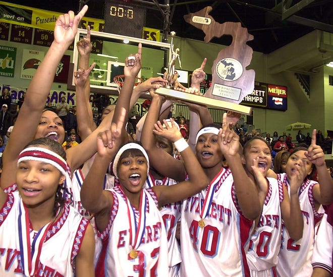 Lansing Everett's girls basketball team celebrates after winning the Class A state championship in 2000. The Vikings beat Detroit Martin Luther King in the final in what was the first of back-to-back state titles.