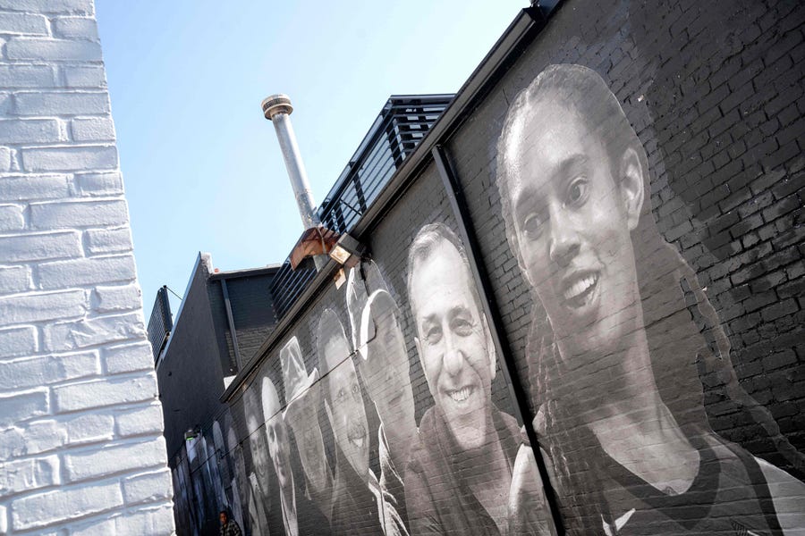 Brittney Griner, who is currently detained in Russia, is depicted in a mural created by artist Isaac Campbell in Washington, DC.