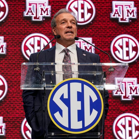 Texas A&M coach Jimbo Fisher shown on the stage du