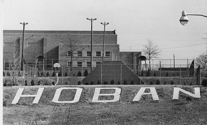 "The Big White Word" takes shape in November 1966 at Archbishop Hoban High School in Akron. The giant sign was a gift from the Class of 1967.
