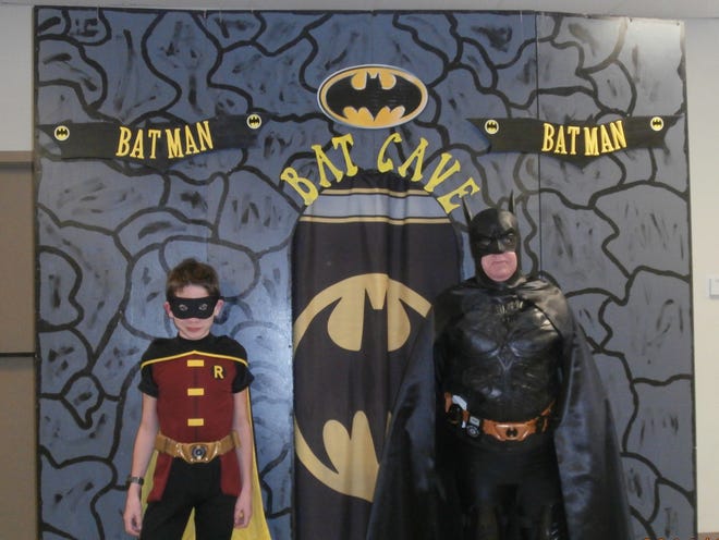 Larry St. Germain (right) and his grandson Devin dress up as superheroes Batman and Robin. They started several years ago visiting libraries, hospitals and birthday parties, putting smiles on children's faces throughout south Louisiana.