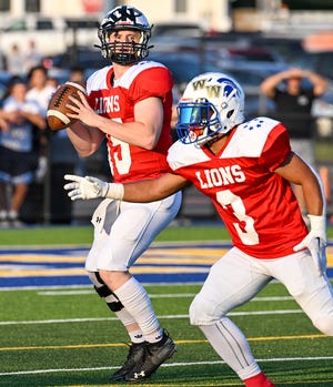 Delaware Valley quarterback CJ Ross spies a target downfield during the second quarter of Wednesday's 88th Annual Dream Game. Ross threw three touchdown passes on the night, leading the County to a 35-21 victory over the City.