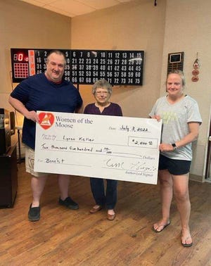 A fundraiser was held in May for Lindsey Keller, right, who is on kidney dialysis and awaiting a kidney transplant. The fundraiser was held at the Aberdeen Moose Lodge. $2,500 was raised total, with $2,116 coming from a bingo bonanza. Packets were provided by Moose bingo. An additional $393 was added as a donation from Moose bingo. Presenting the check is Tim Hagadone, Aberdeen Moose President, and Mary Ann Schlosser, Moose bingo organizer.