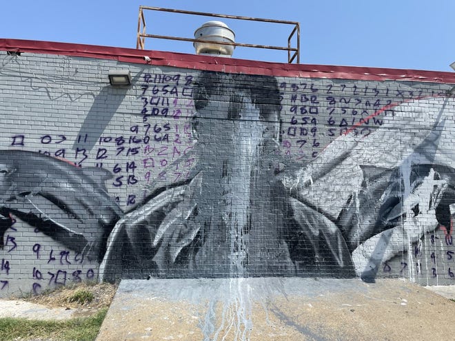 A mural set to honor Young Dolphfor his birthday was defaced overnight Wedensday into Thursday.