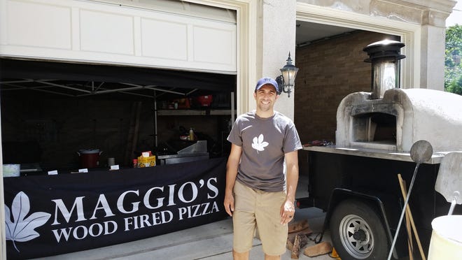 Jeremy Maggio stands in front of his wood-fired pizza trailer in June 2017. He has since sold the trailer, but is planning to open his restaurant, Maggio's Wood Fired Pizza, in Wauwatosa in January 2023.