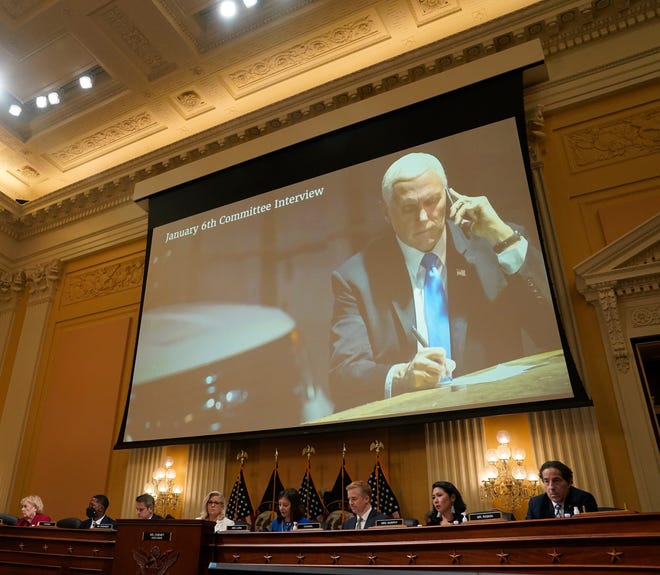 A photograph of former Vice President Mike Pence during the capitol riot is displayed during a public hearing before the House select committee to investigate the January 6 attack on the United States Capitol.
