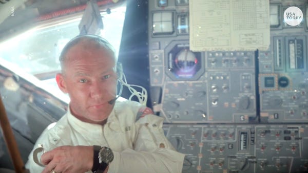 NASA astronaut Buzz Aldrin in the jacket being auc