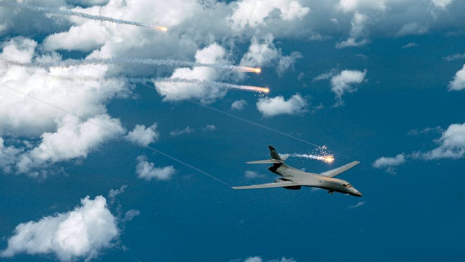 A U.S. Air Force B-1B Lancer, assigned to 34th Expeditionary Bomb Squadron, deploys flares during a Bomber Task Force mission over the Pacific Ocean, June 25, 2022. Bomber Task Force missions provide opportunities to train alongside our allies and partners to build interoperability and bolster the collective ability to support a free and open Indo-Pacific.