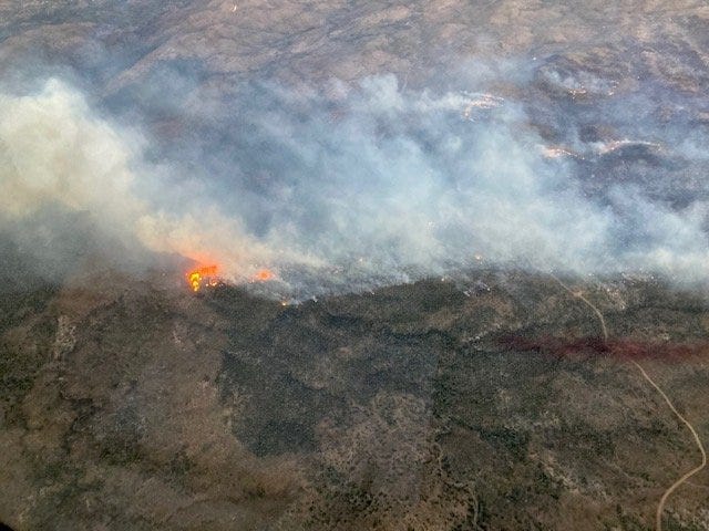 An aerial photograph shows the progress of the Dodge Springs Fire near the Utah-Nevada border.