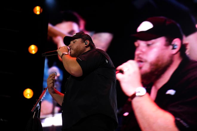 Headliner Luke Combs performs at Buckeye Country Superfest at Ohio Stadium last Sunday.