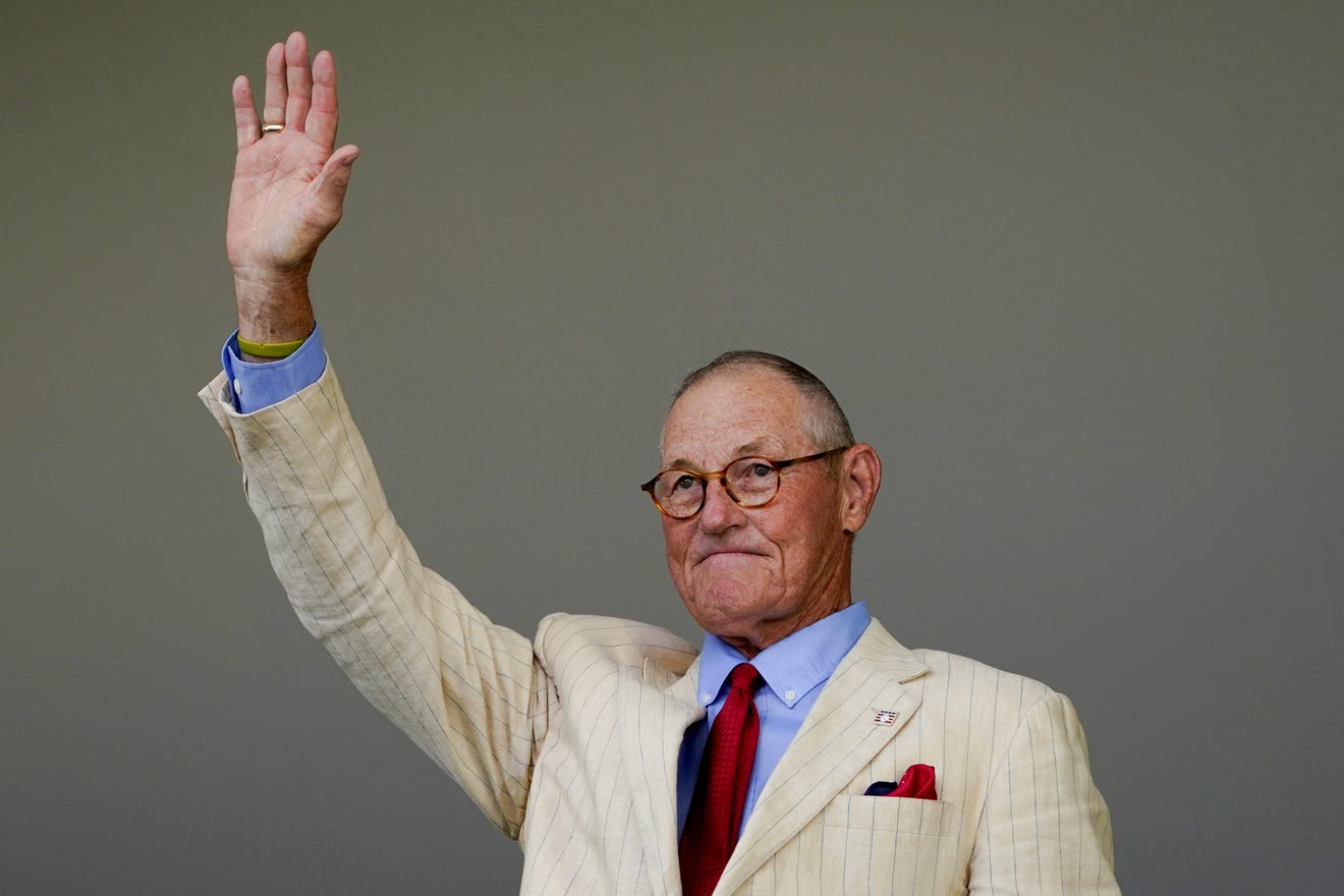 Hall of Fame inductee Jim Kaat, formerly of the Minnesota Twins, waves to the crowd after speaking during the National Baseball Hall of Fame induction ceremony, Sunday, July 24, 2022, in Cooperstown, N.Y. (AP Photo/John Minchillo)