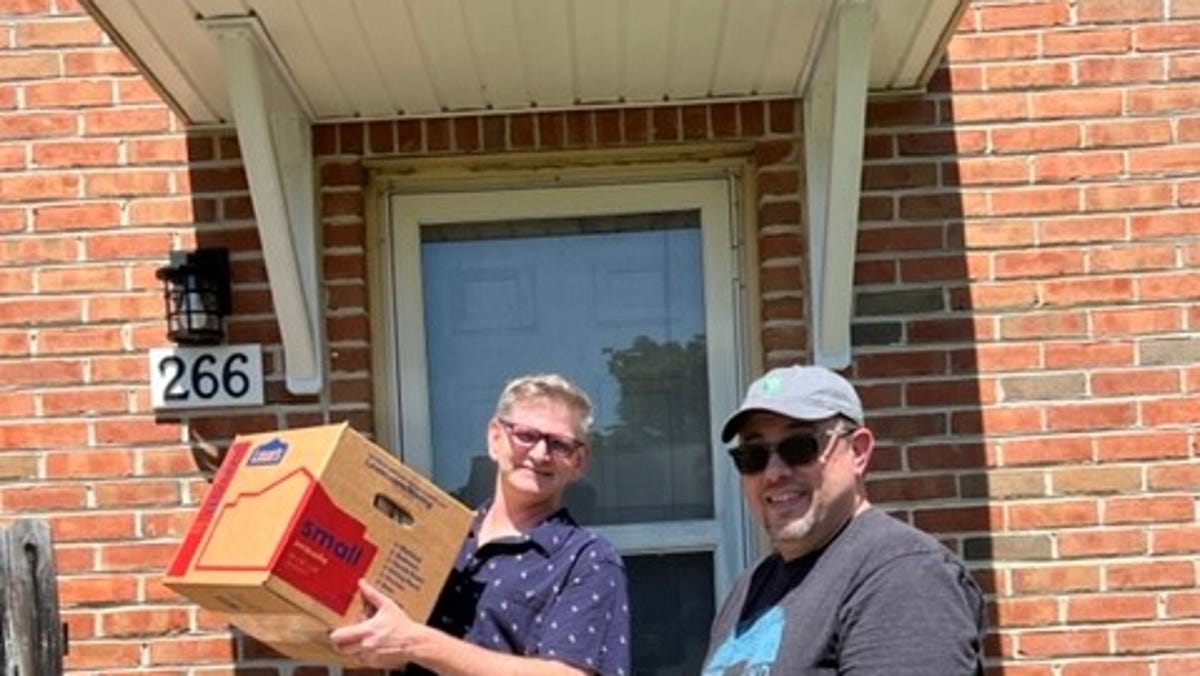 Matthew Hambleton and his husband Kevin Lowrie are all smiles as they move into their new home in suburban Philadelphia. The couple got a second chance to get their home after being outbid a couple of months ago and the original bidder's deal fell through.