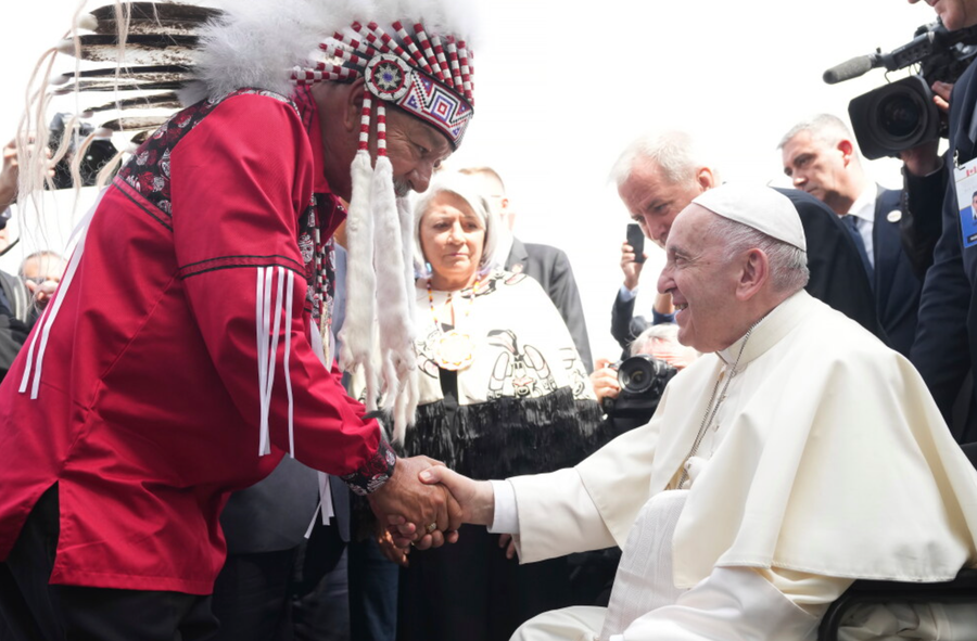 Pope Francis is greeted by George Arcand, Grand Chief of the Confederacy of Treaty Six First Nations, as he arrives in Edmonton, Alberta, Canada. His visit to Canada is aimed at reconciliation with Indigenous people for the Catholic Church's role in residential schools.