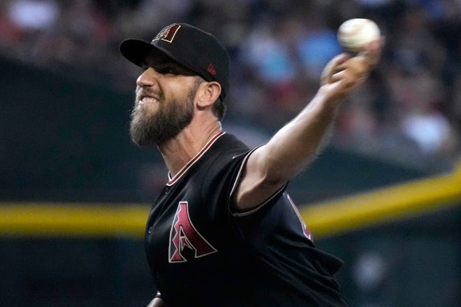 Arizona Diamondbacks starting pitcher Madison Bumgarner throws against the Washington Nationals in the first inning at Chase Field.