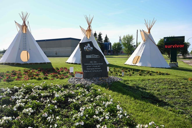 A monument honoring the survivors of the Ermineskin Indian Residential School displayed near the site of the school in Maskwacis, Alberta, on July 23, 2022, ahead of Pope Francis' visit to Canada.  The pope is expected to offer an apology to Indigenous peoples for more than a century of abuses at state schools run by the church in Canada.