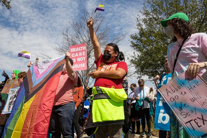 Supporters of trans children gather for the transgender rights rally in front of the Texas Governor's Mansion on Sunday, March 13, 2022. 