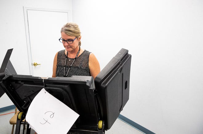 Brandi Cothron votes at the Maury County Election Commission during early voting in Columbia, Tenn., July 22, 2022.