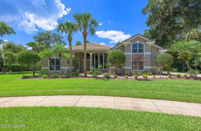 Hitting the market for the first time since it was custom designed and built in 1997, this home sits on a private half-acre cul-de-sac in the Ormond Beach community of Halifax Plantation.