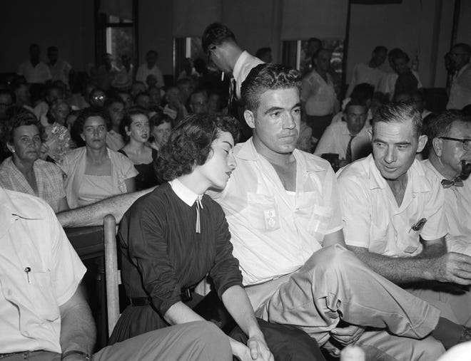 In this Sept. 22. 1955 photo, Carolyn Bryant rests her head on her husband Roy Bryant's shoulder after she testified in Emmett Till murder court case in Sumner, Miss. (AP Photo, File)