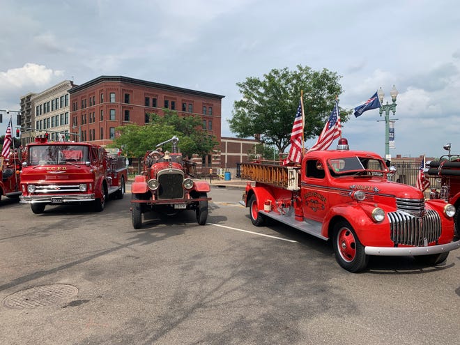 A line of antique firetrucks at the Canton Fire Department's bicentennial celebration Sunday, July 24, at Centennial Plaza.