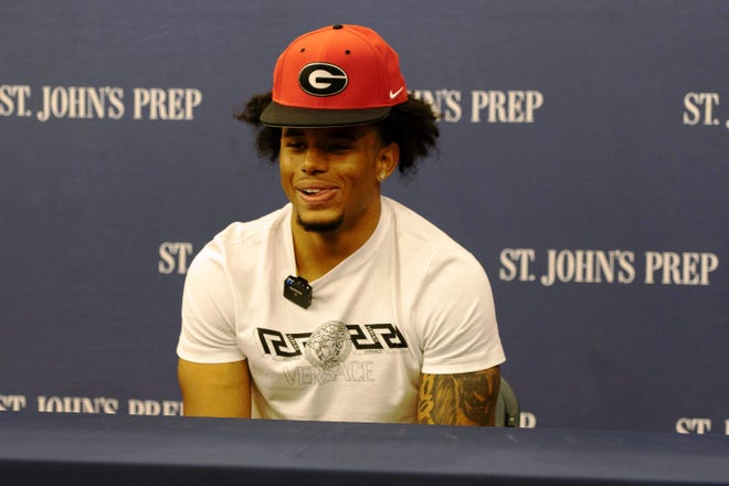 Eagles defensive back Joenel Aguero, a consensus national Top 25 recruit, shares a moment of levity with the media in attendance after announcing that he will continue his football career at the University of Georgia in 2023 following his final high school season at St. John’s Prep.