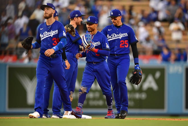 Dodgers players celebrate a win against the Giants at Dodger Stadium.