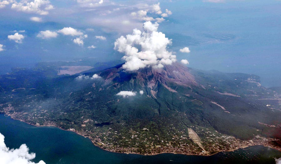 This aerial photo shows Sakurajima volcano in Kagoshima, southern island of Kyushu, Japan, one day after its eruption on July 25, 2022. The volcano spewed ash and large rocks into the nighttime sky on Sunday.