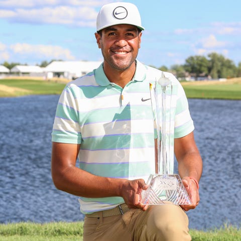 July 24: Tony Finau poses with the trophy after wi