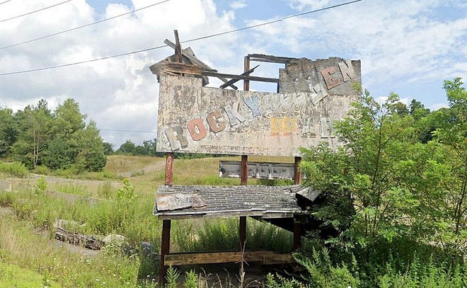 A talk on the historic, former Rocky Glen Amusement Park in Lackawanna County, is the focus of the next lecture in a series hosted by the Dorflinger Factory Museum in White Mills, Pa., August 7. Pictured is what is described as the "last bit of evidence" of the park, the remains of a sign. The park closed in 1987. Photo by RaydenAG in October 2021; licensed under the CC Attrib.-Share Alike 4.0 International License.
