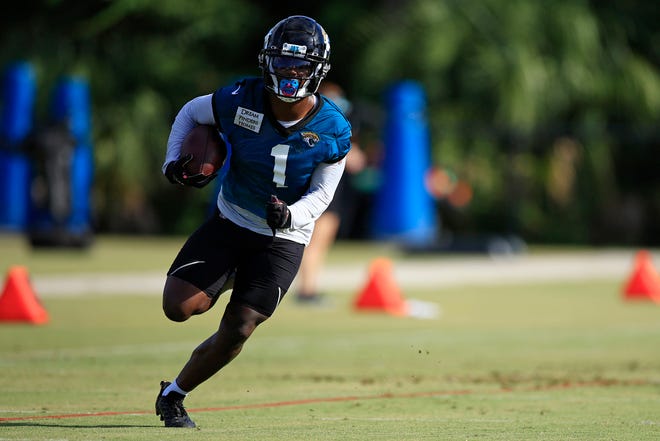 Jacksonville Jaguars running back Travis Etienne Jr.  (1) runs during day 2 of the Jaguars Training Camp Tuesday, July 26, 2022 at the Knight Sports Complex at Episcopal School of Jacksonville. 
