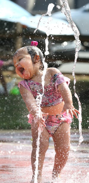 Sophie Ramirez cools off in the water during the  Mauney Memorial Library’s Field Day held Tuesday, July 26, 2022, at Patriots Park in Kings Mountain.