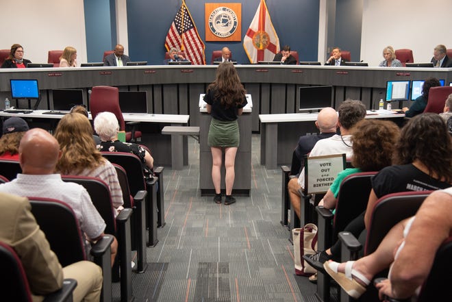 Sarasota County resident Leah Tiberini, 22, admonished the board of county commissioners from behind a mask that said “I Support Animal Rights” with a picture of a bunny rabbit on it.
