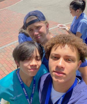 Jeffrey Radek Jr., 17, of Rochester (front, right) takes a selfie with some new friends he made at the National Youth Leadership Forum: Medicine at Tufts University in Medford.