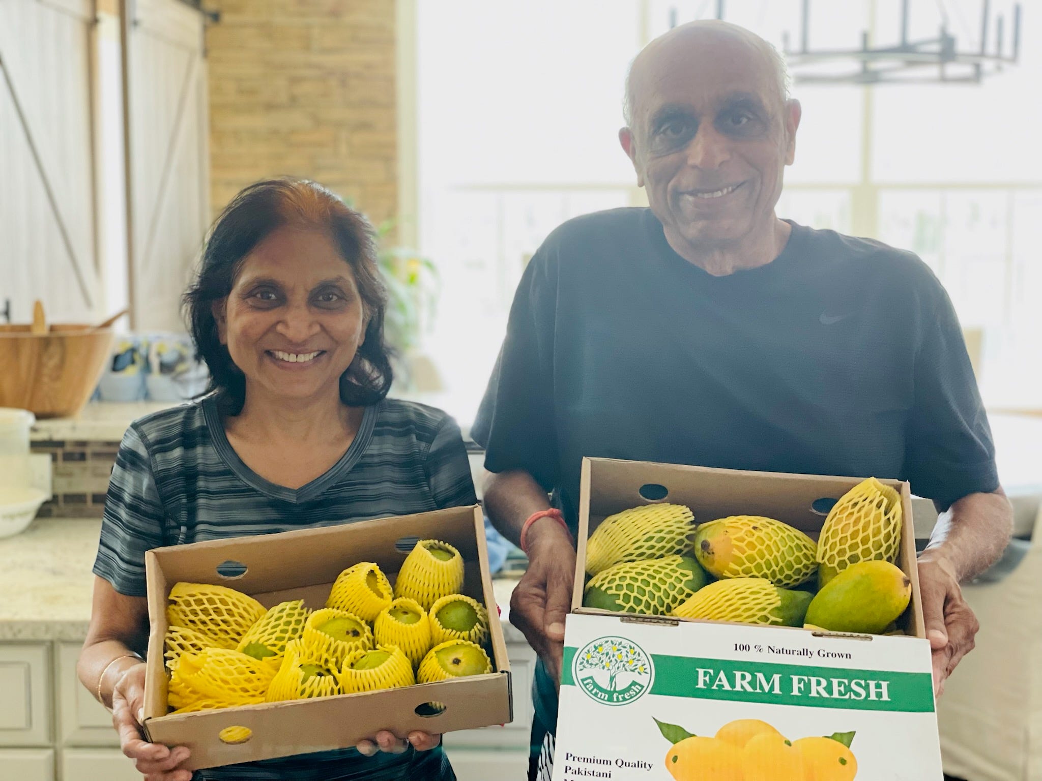 Anjan Patel's family holds their Pakistani mangoes.