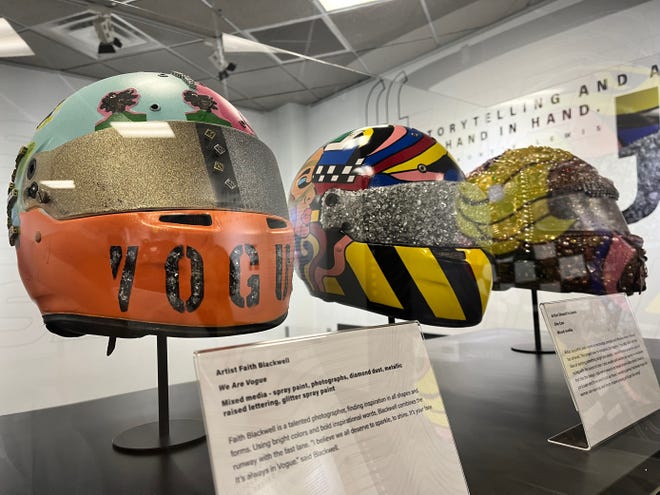 Three of nine helmets created by local artists on display at Sleek: The Art of the Helmet, the new exhibition at the Indianapolis Motor Speedway. From left to right, they were created by Faith Blackwell, Shaunt'e Lewis and Jessica Bowman.