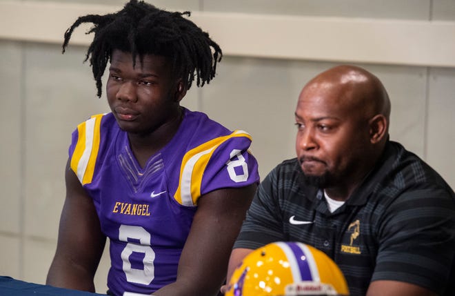 Evangel Christian’s Nii Addy and coach Darius Dixon are interviewed during the 2022 River Region High School Football Media Day at Trinity Presbyterian School in Montgomery, Ala., on Tuesday, July 26, 2022.