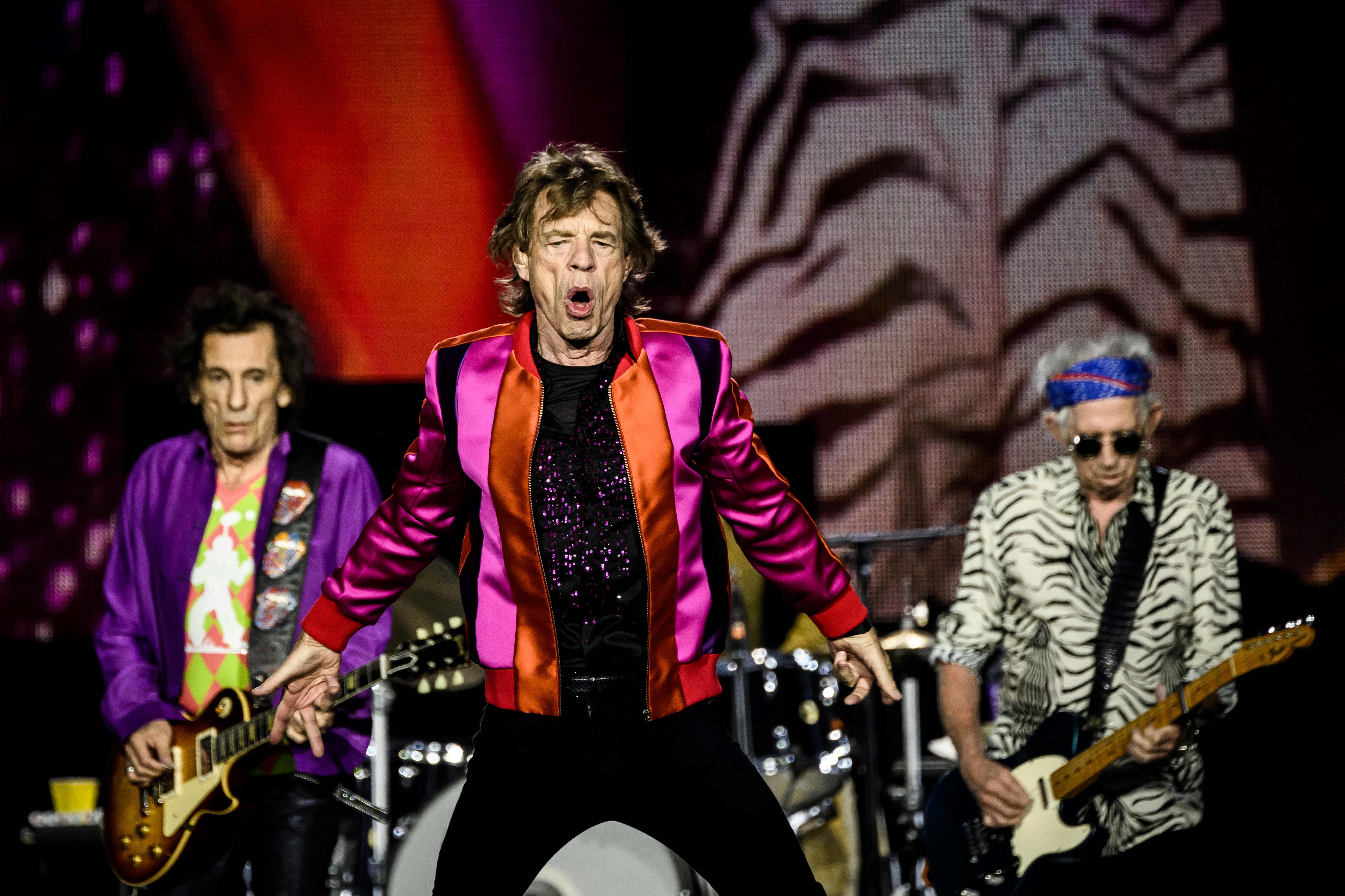 British rock band The Rolling Stones' singer Mick Jagger (C), guitarists Keith Richards (R) and Ron Wood (L) perform during a concert part of their European Tour on July 19, 2022 in Decines-Charpieu's Stadium, near Lyon. (Photo by JEFF PACHOUD / AFP) (Photo by JEFF PACHOUD/AFP via Getty Images) ORIG FILE ID: AFP_32EX467.jpg