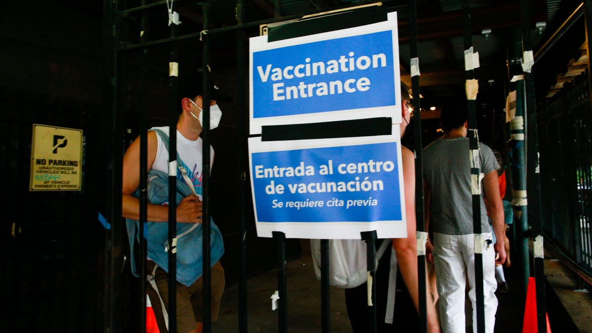People wait in line to recieve the Monkeypox vaccine before the opening of a new mass vaccination site at the Bushwick Education Campus in Brooklyn on July 17, 2022, in New York City. (Photo by Kena Betancur / AFP) (Photo by KENA BETANCUR/AFP via Getty Images) ORIG FILE ID: AFP_32EP3M3.jpg