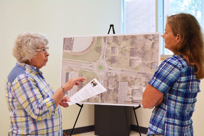 Miriam Steffan, left, chats with Allison Anderson, Ash Street Improvements project manager, on Tuesday during an open house meeting at the Activity & Recreation Center.