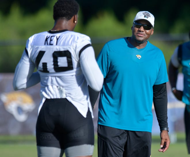 Jaguars defensive coordinator Mike Caldwell talks to linebacker Arden Key during a training camp practice on July 27 at the Episcopal School's Knight Campus.