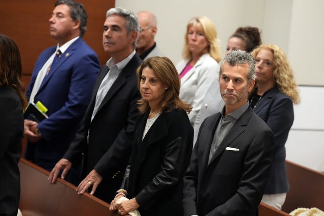 Max and Caryn Schachter, right, with Tom Hoyer, third from right, stand with family members of victims of the Marjory Stoneman Douglas High School shootings during the penalty phase of the trial of confessed killer Nikolas Cruz at the Broward County Courthouse in Fort Lauderdale on Wednesday, July 27, 2022. The Schachter’s son, Alex, and Hoyer’s son, Luke, were killed in the 2018 shootings. Cruz previously plead guilty to all 17 counts of premeditated murder and 17 counts of attempted murder in the 2018 shootings.