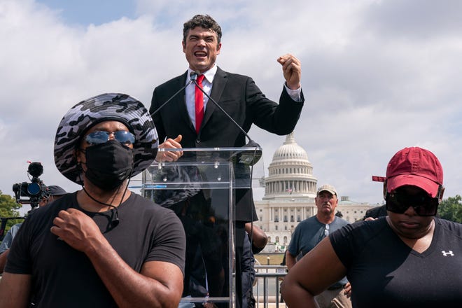 Joe Kent, center, a Republican who is challenging Rep. Jaime Herrera Beutler, R-Wash., for her seat in Washington's 3rd Congressional District, speaks during a "Justice For J6" rally near the U.S. Capitol in Washington, on Sept. 18, 2021.