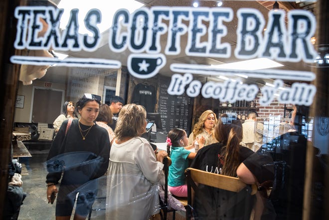 People fill chairs at Texas Coffee Bar on Wednesday, July 27, 2022. The new cafe, located inside Meche Beauty and Boutique, opened in mid-July.